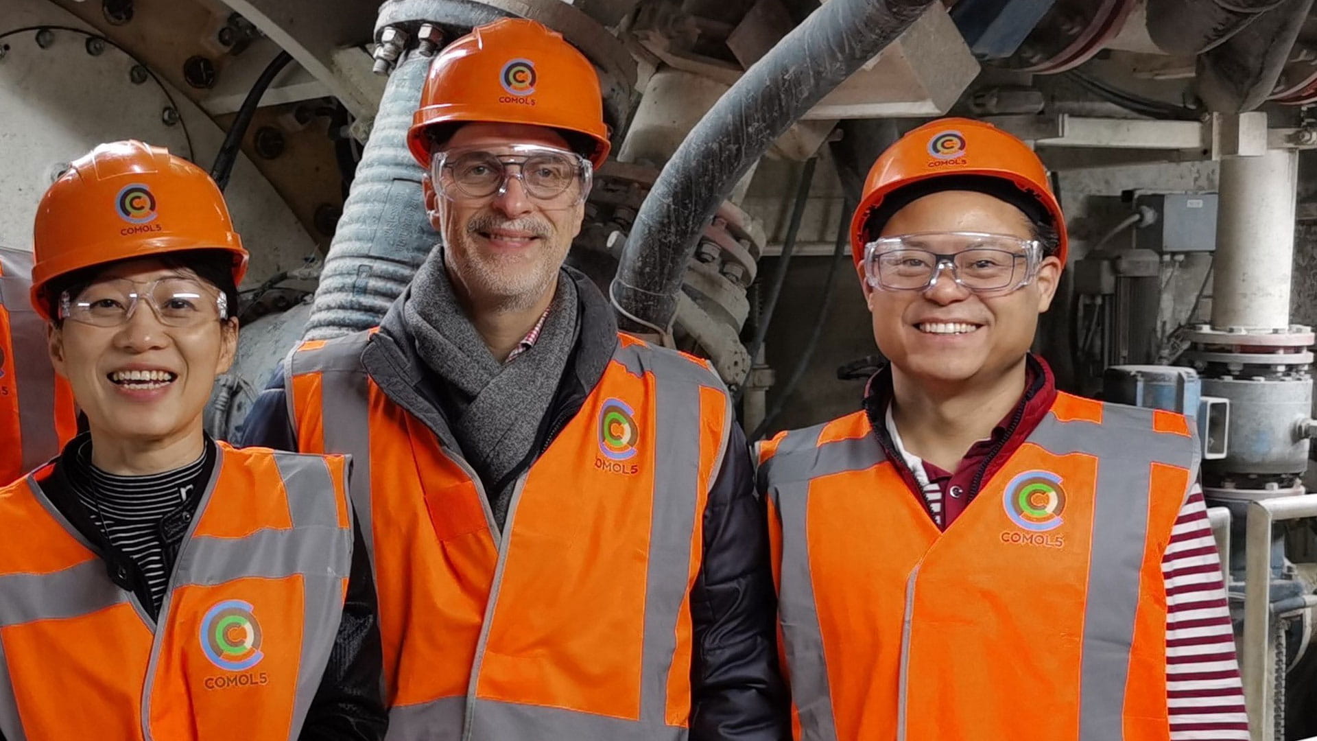 three people wearing protection clothing