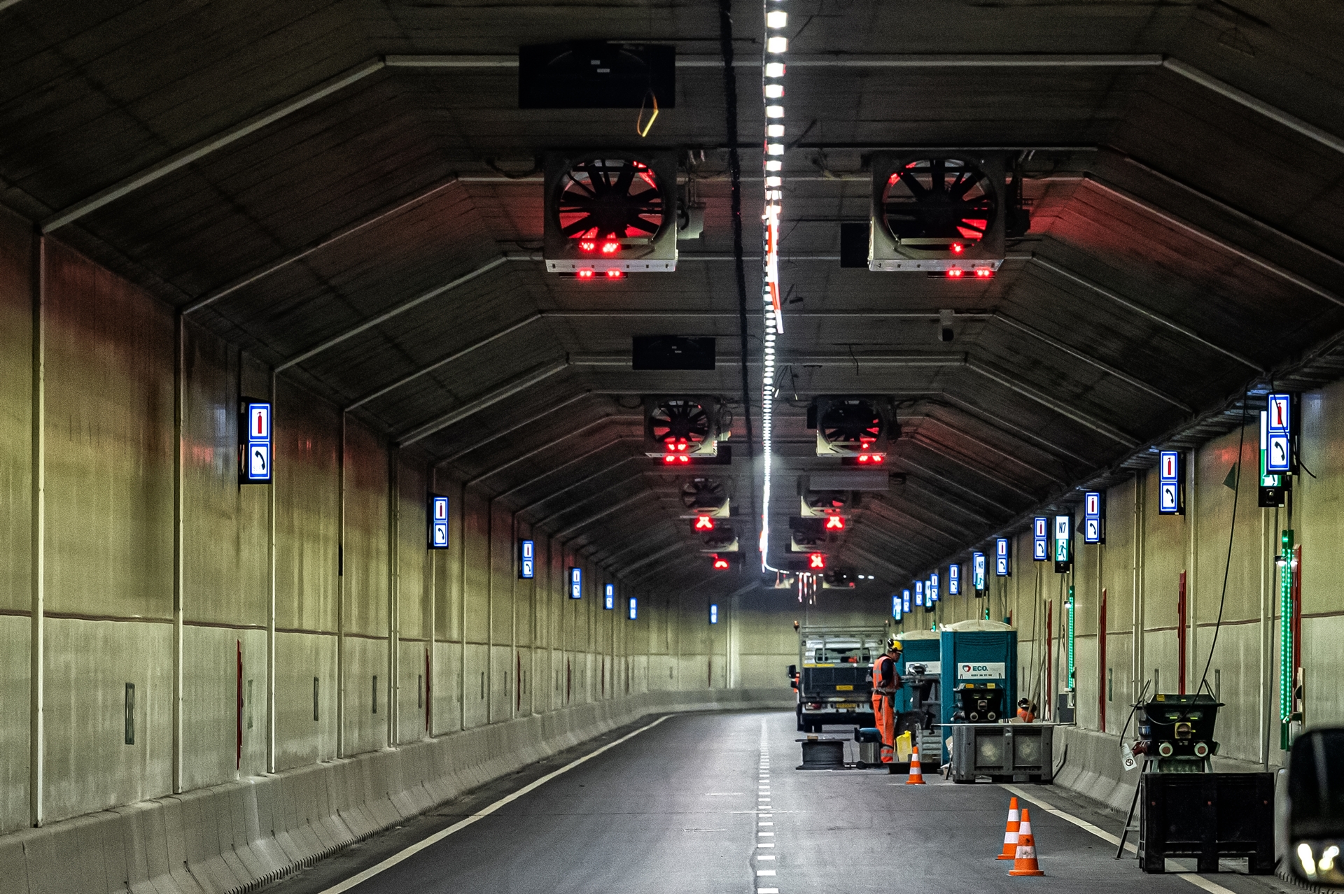 The inside of tunnel with a person working there