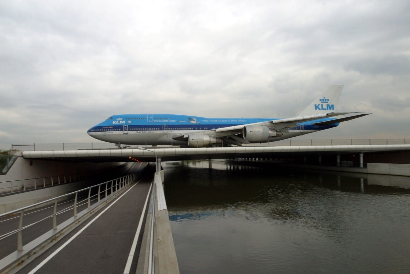Airplane crossing a viaduct